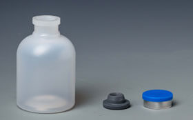 Comparison of two materials of plastic vaccine bottle